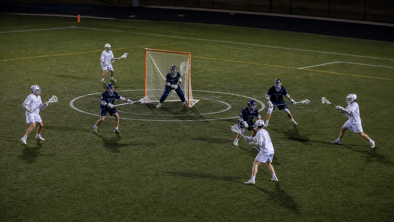 Lacrosse players demonstrating concepts from How Scoring Works in Men’s Lacrosse